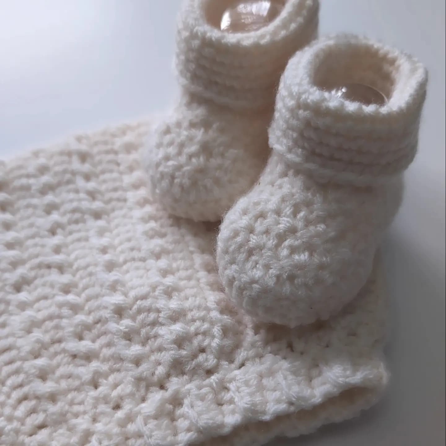 Instagram post: 🤍 Our Crocheted Baby Booties and Bonnet Bundle 👶...